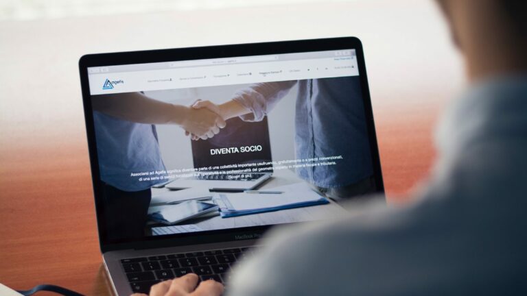 man working on laptop seen from behind