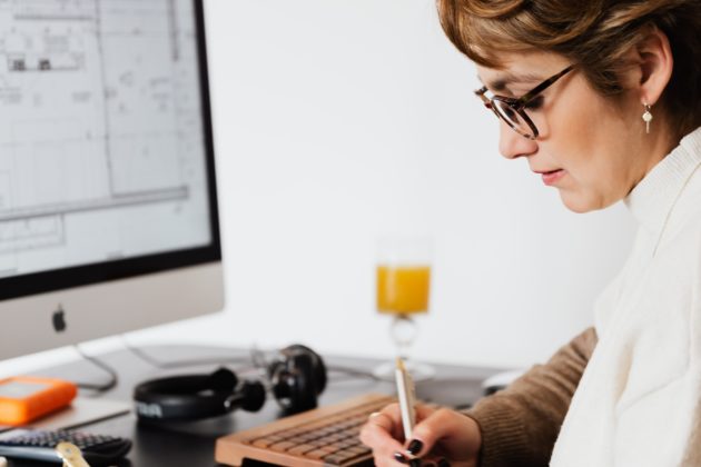 Woman writing at a desk