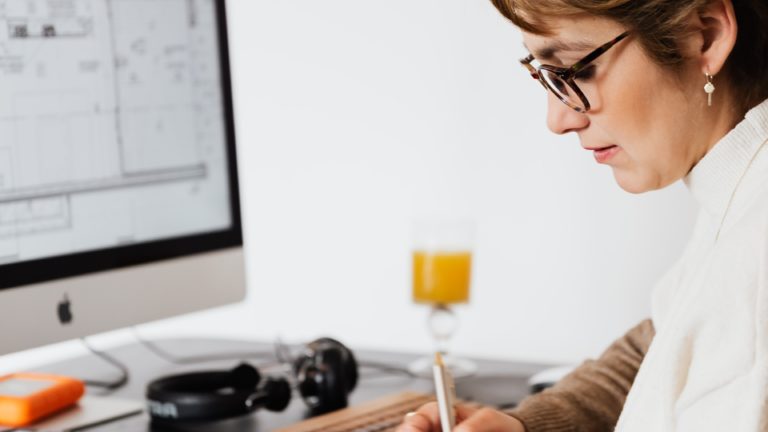 Woman writing at a desk